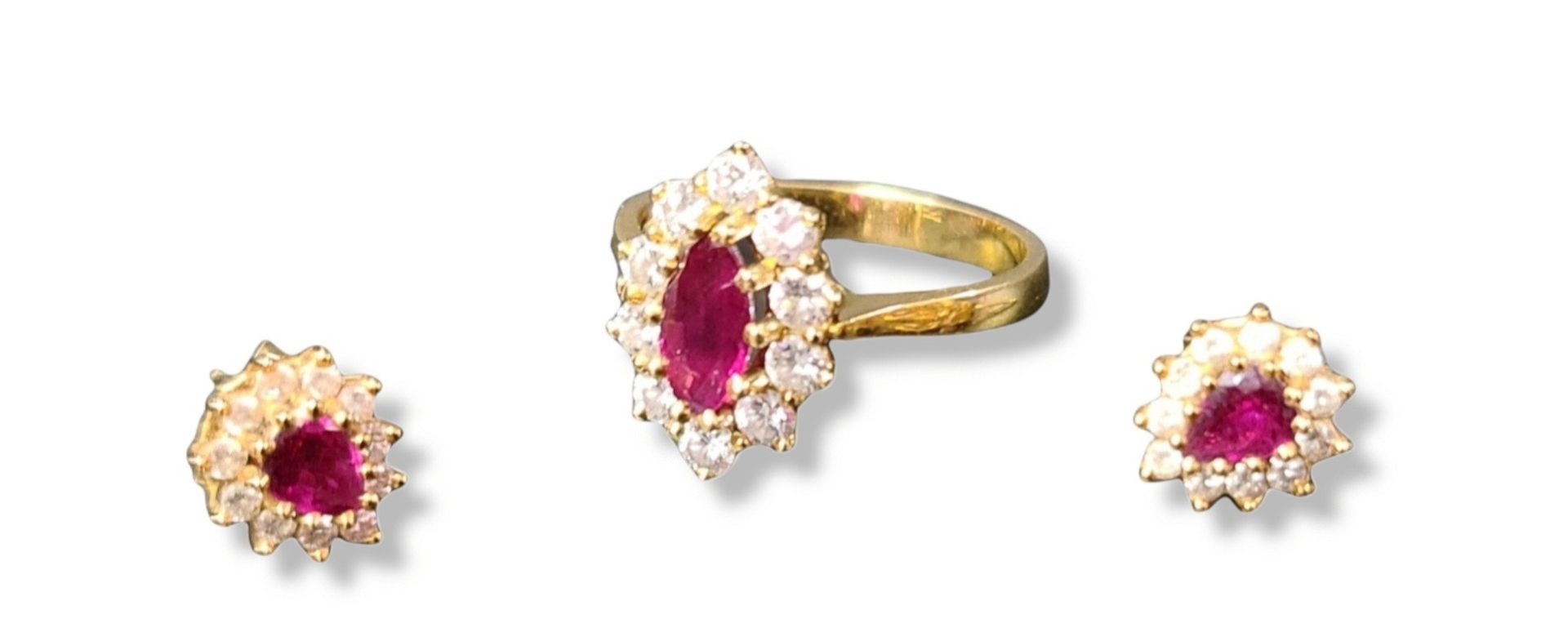 Null Gold ring with a ruby stone and a pair of earrings of similar construction.&hellip;