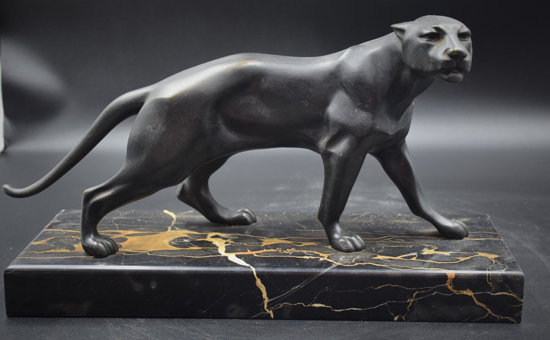 Null Panther. Art deco bronze with black patina on a Portor marble base. Signed &hellip;