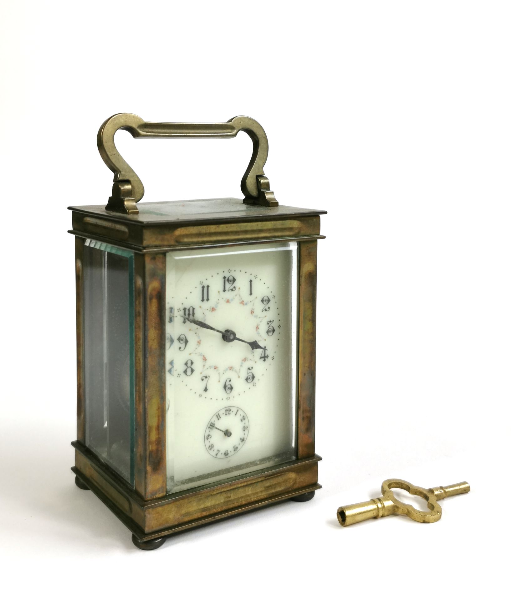 Null Officer's clock, the brass cage and bevelled glasses surmounted by a handle&hellip;