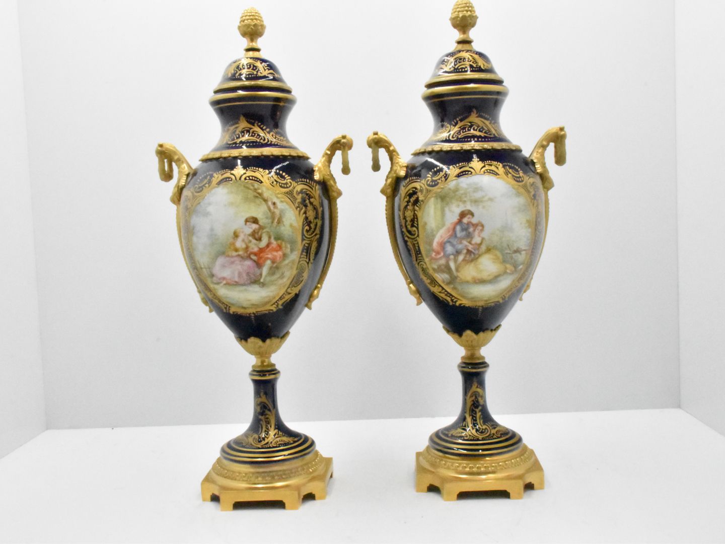Null Pair of vases in Sèvre porcelain décor main and gilt bronze height: 58 cm. &hellip;
