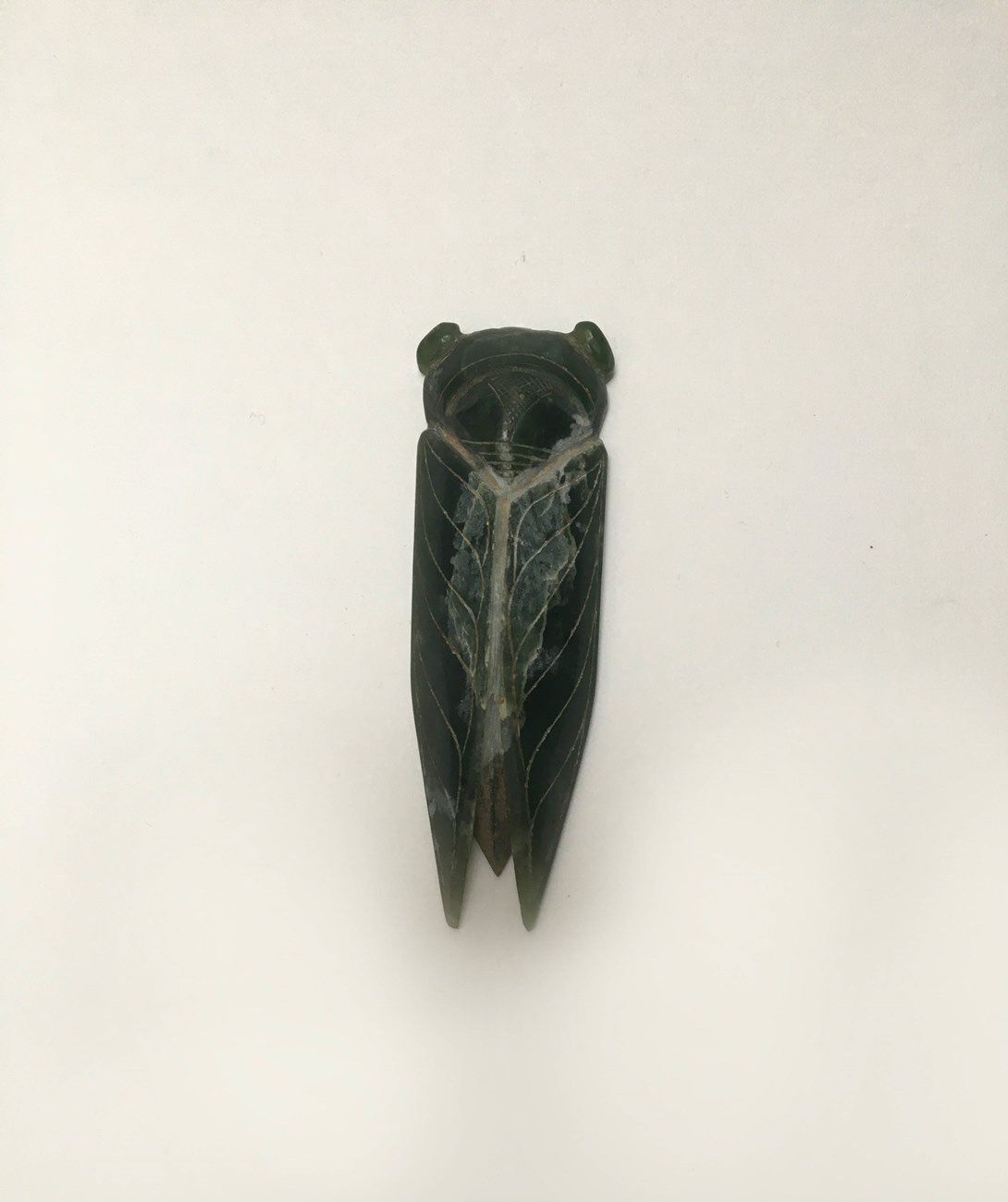 Null Cicada in dark green jade. The eyes, wings and abdomen are very finely engr&hellip;