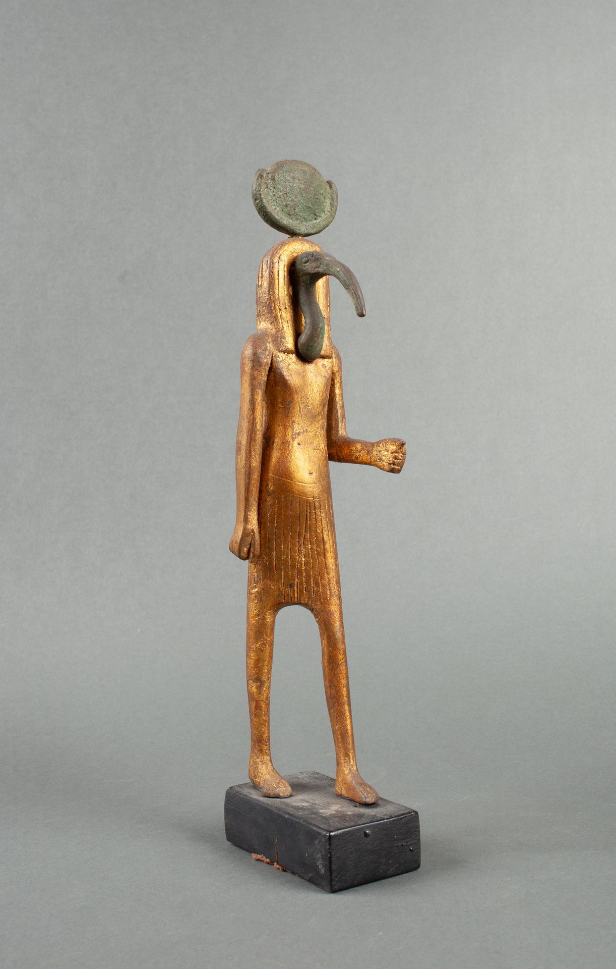 Null Gilded statuette representing the God Thoth walking. Only the beak and the &hellip;