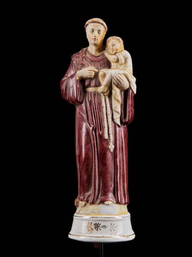 Null 
Antiguo figurín de colección de un santo con el Cristo niño en sus brazos