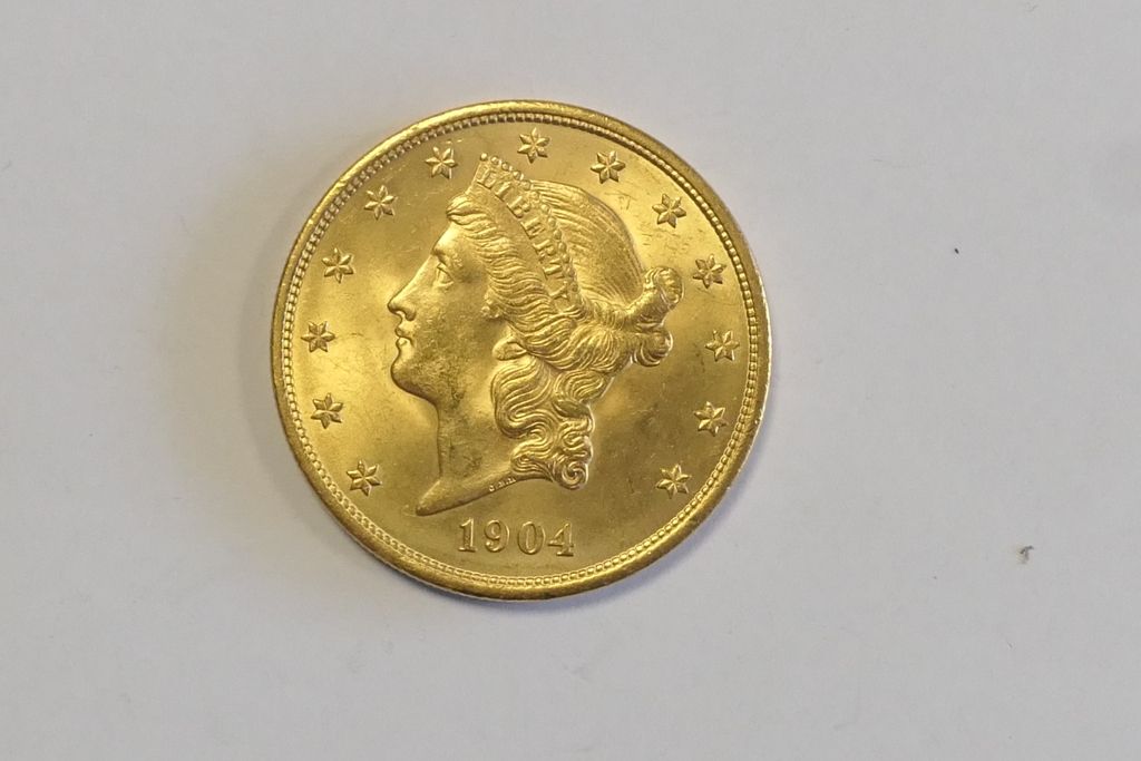 Pièce de 20 dollars en or de 1904 33,5 gr approximately.