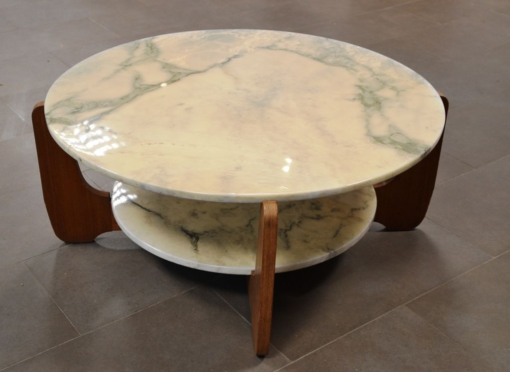 Hugues POIGNANT (Xxème siècle) Wooden coffee table with double marble top.
D.: 8&hellip;
