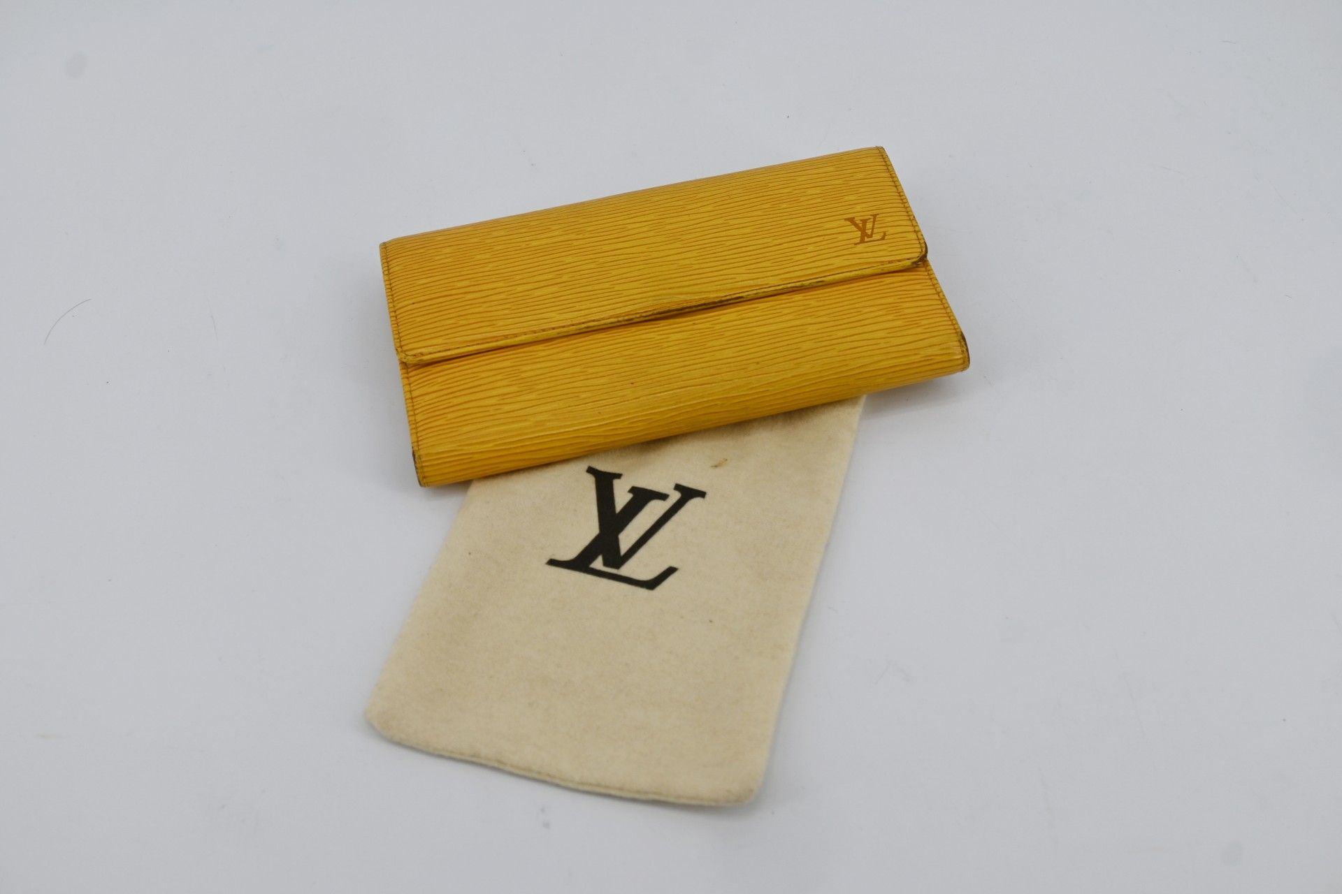 LOUIS VUITTON - Yellow epi leather wallet, snap closure…
