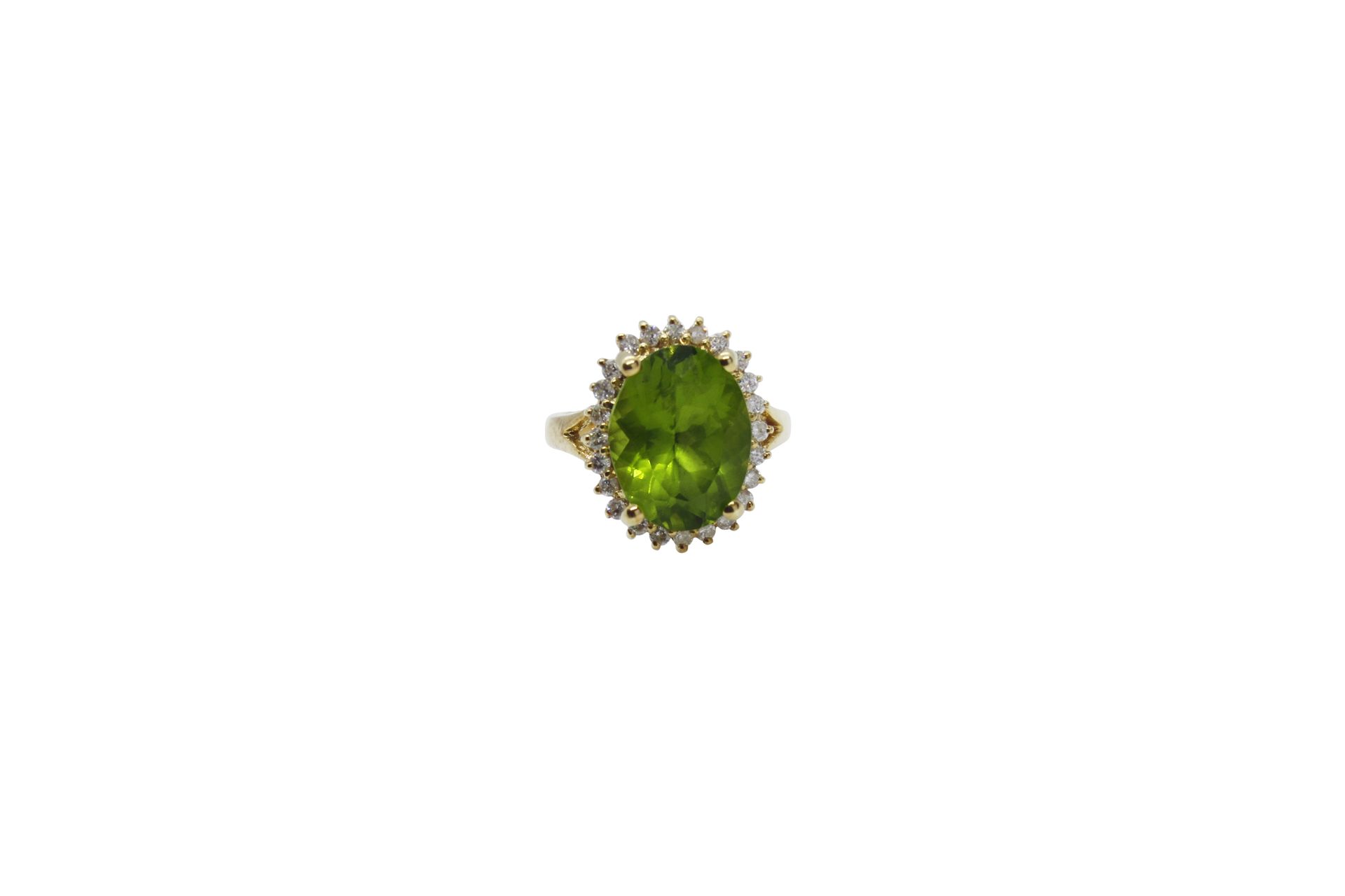 A 7ct peridot with 0,45ct diamonds 18k gold ring A 7ct peridot with 0,45ct diamo&hellip;