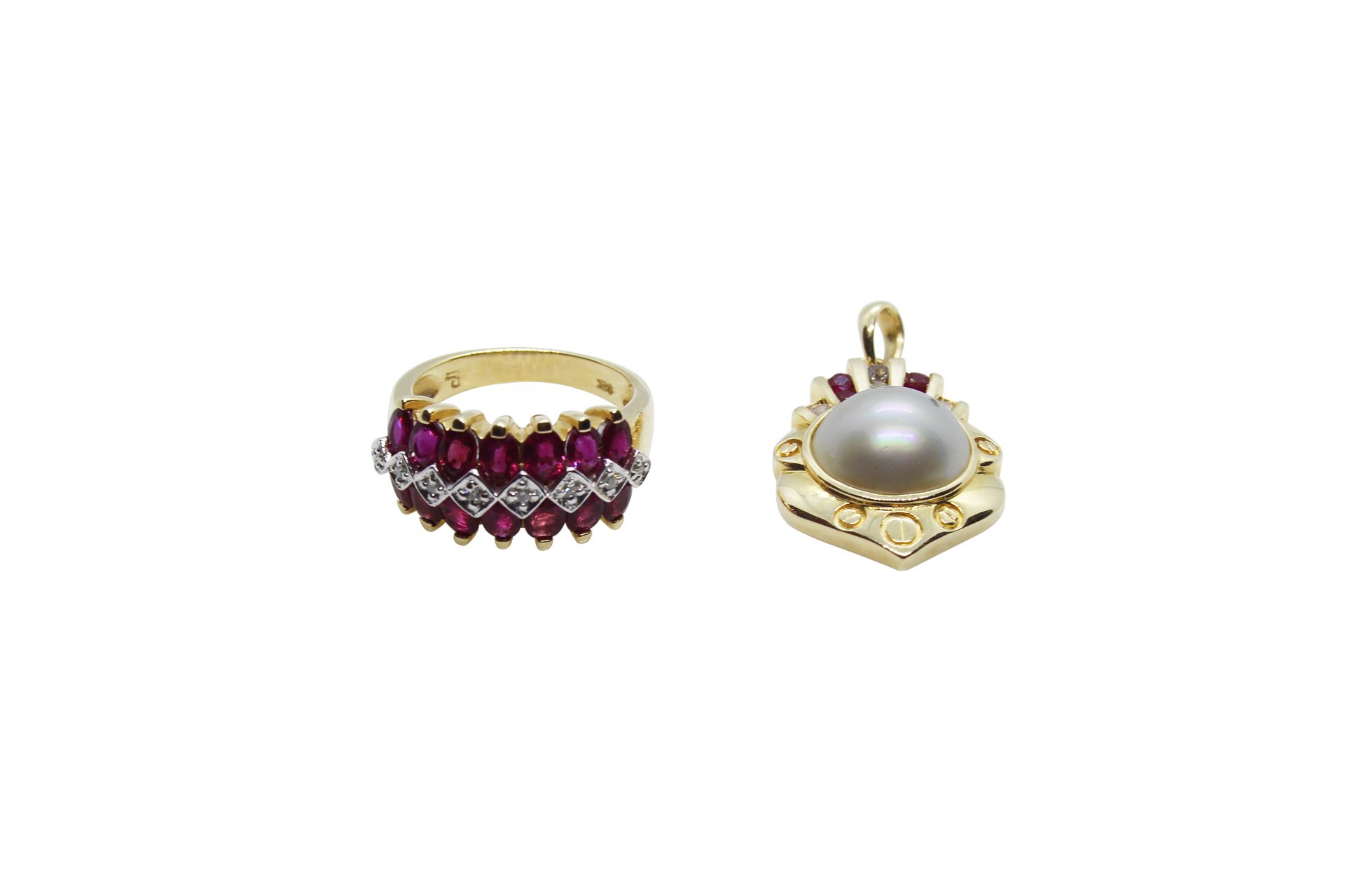 A jewellery lot comprising of a 14k gold ruby and diamond ring and a 14k gold ru&hellip;