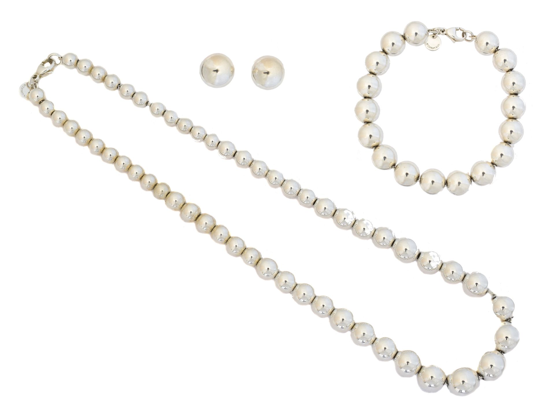 A suite of Tiffany & Co. Jewellery, 
一套蒂芙尼珠宝，包括项链、手镯和耳环，每件都是由抛光球形珠子和花式链线设计而成，签有蒂&hellip;