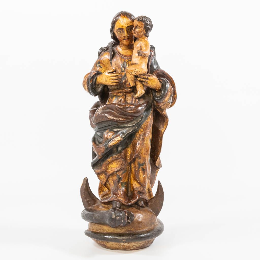 Null A wood sculptured Madonna with child trampling the serpent on the half moon&hellip;