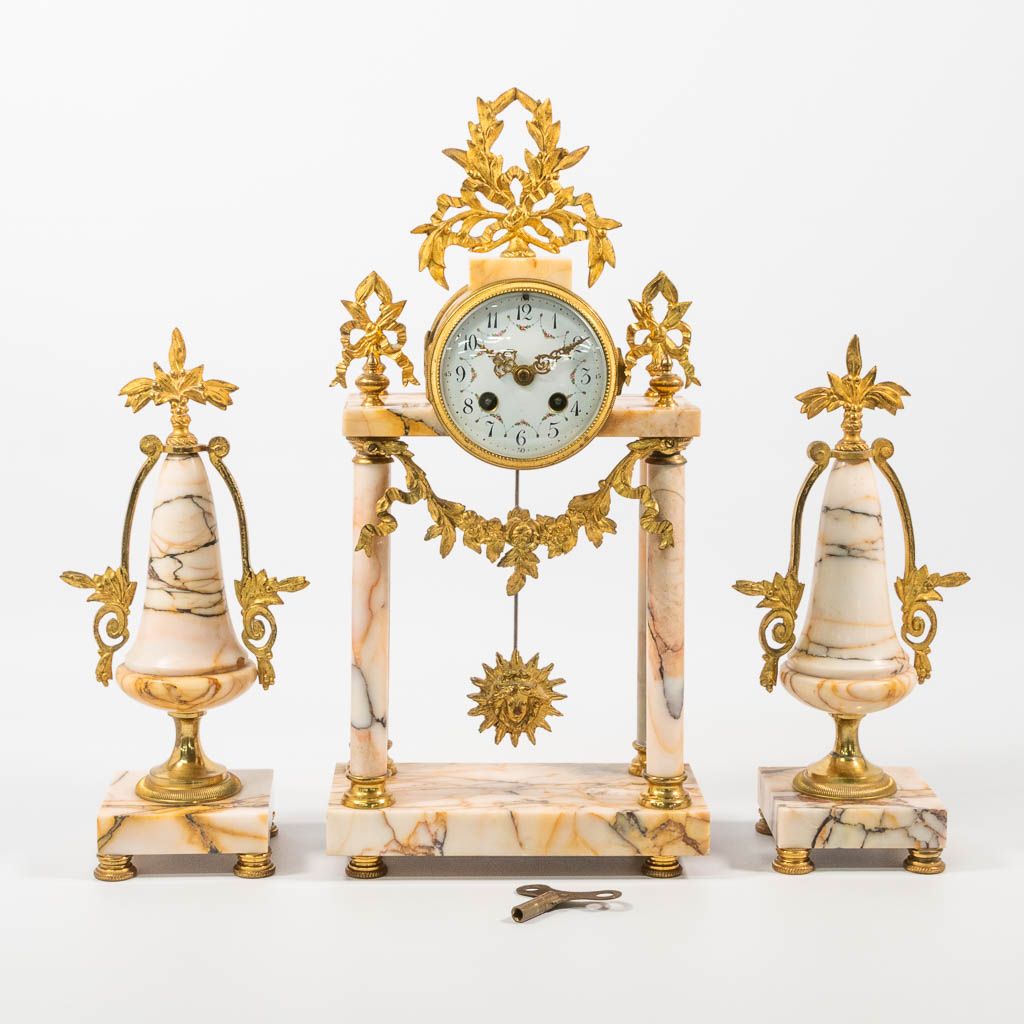 Null A 3-piece mantle clock: a column clock with 2 side pieces. Made of marble w&hellip;