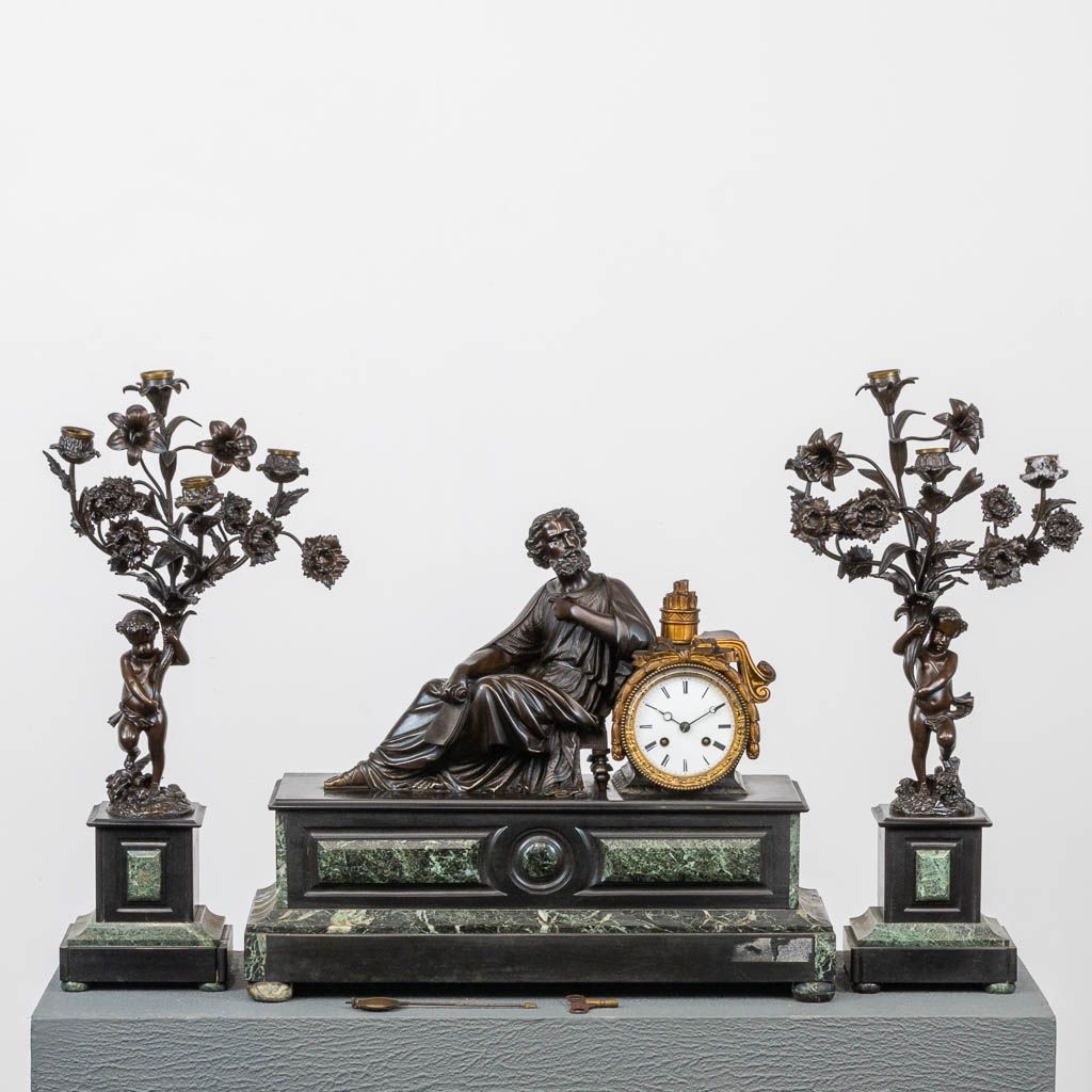 Null A 3-piece mantle garniture consisting of a clock with bronze figurine and 2&hellip;