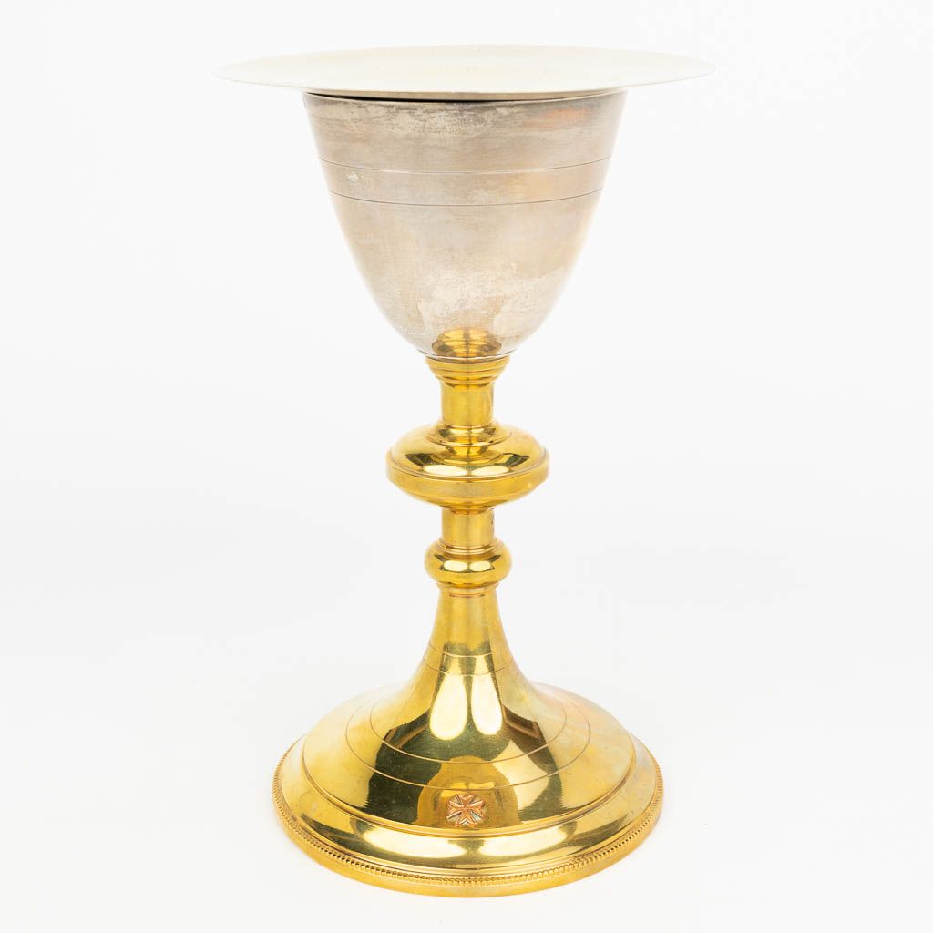 Null A gold-plated silver chalice made in neogothic style and marked 800/1000. T&hellip;