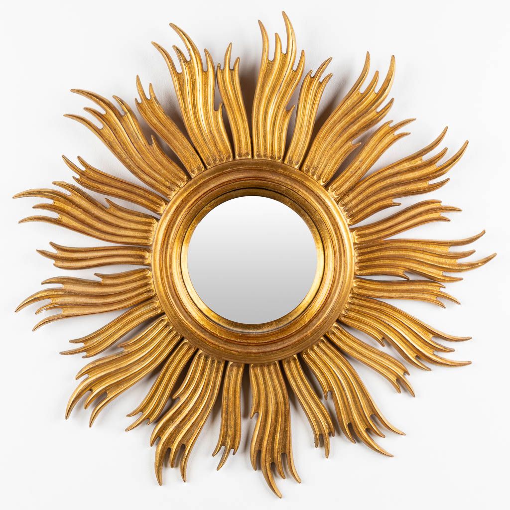 Null 
A sunburst mirror, sculptured wood with a convex mirror. Circa 1960. 


Di&hellip;