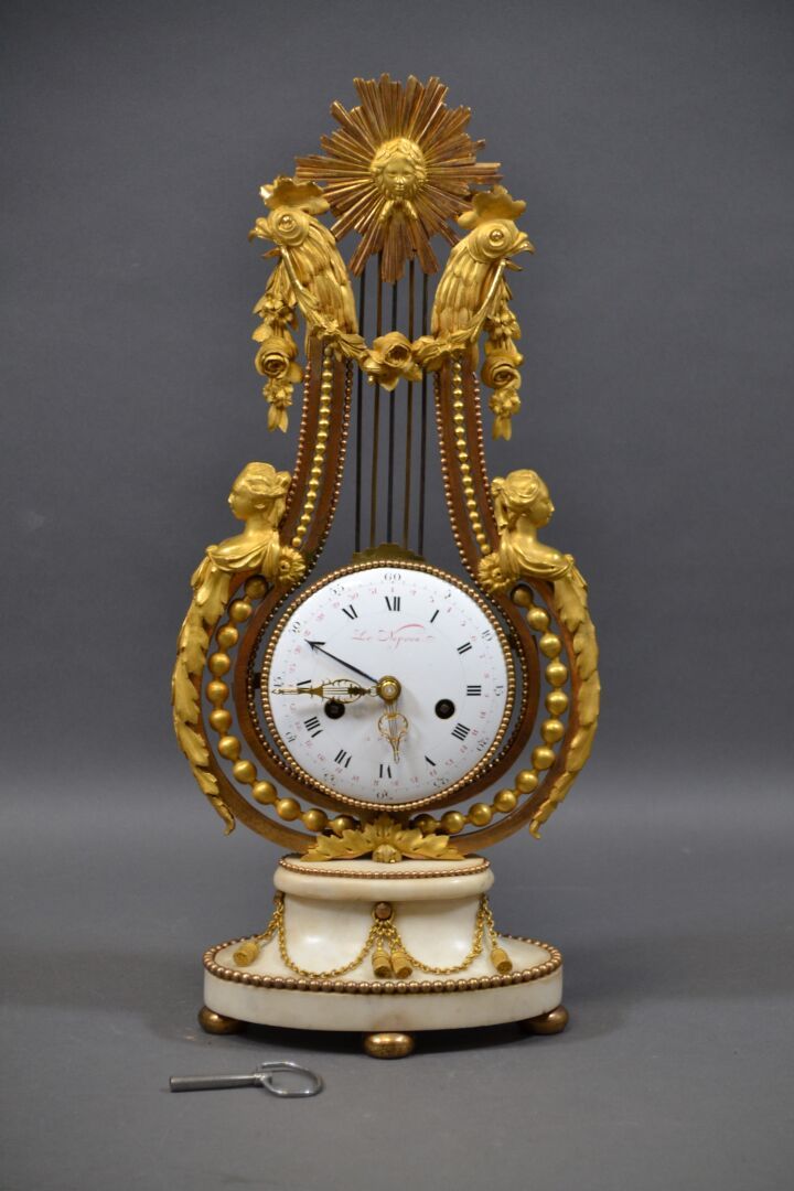 Null Lyre clock in gilded broze and white marble, the circular enameled dial wit&hellip;