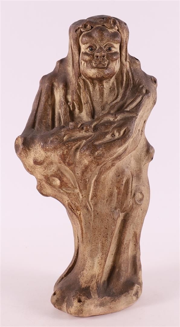 Null A stoneware forest demon in the shape of a tree stump, Japan, circa 1900.