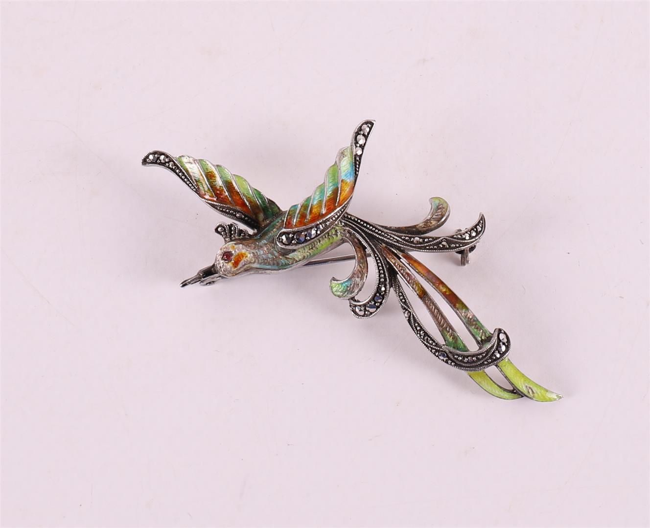 Null An enamelled brooch in the shape of a bird of paradise with marcasites.