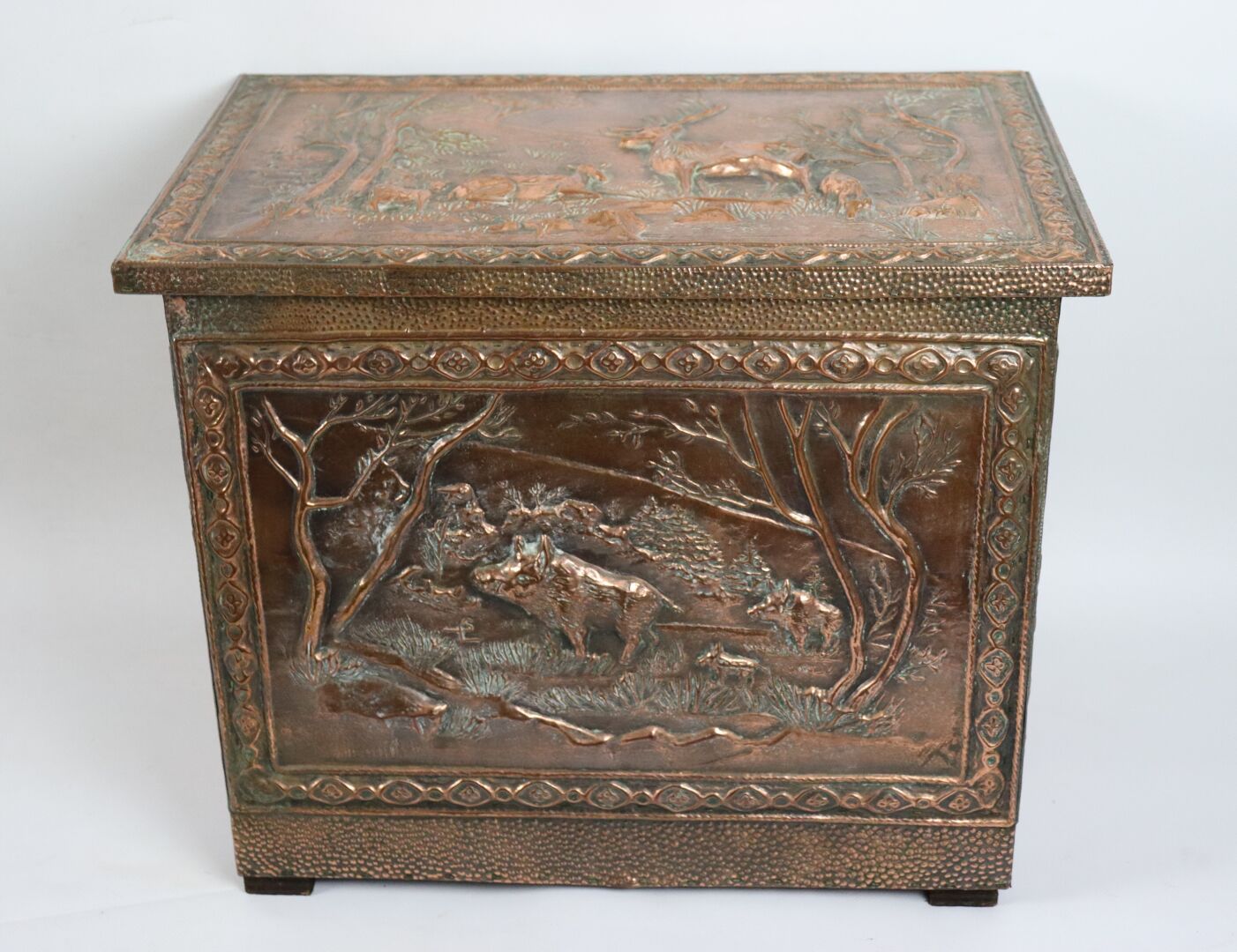 Null Wooden chest decorated with embossed copper plates with hunting decoration.&hellip;