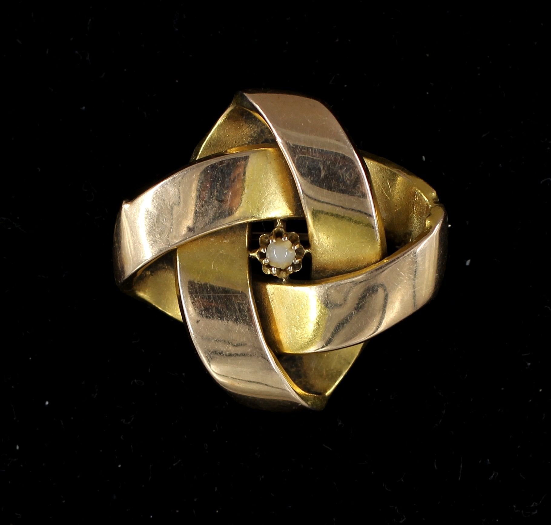 Null *Broche nœud en or jaune 14k et une pierre blanche, pds brut : 3,9 g.