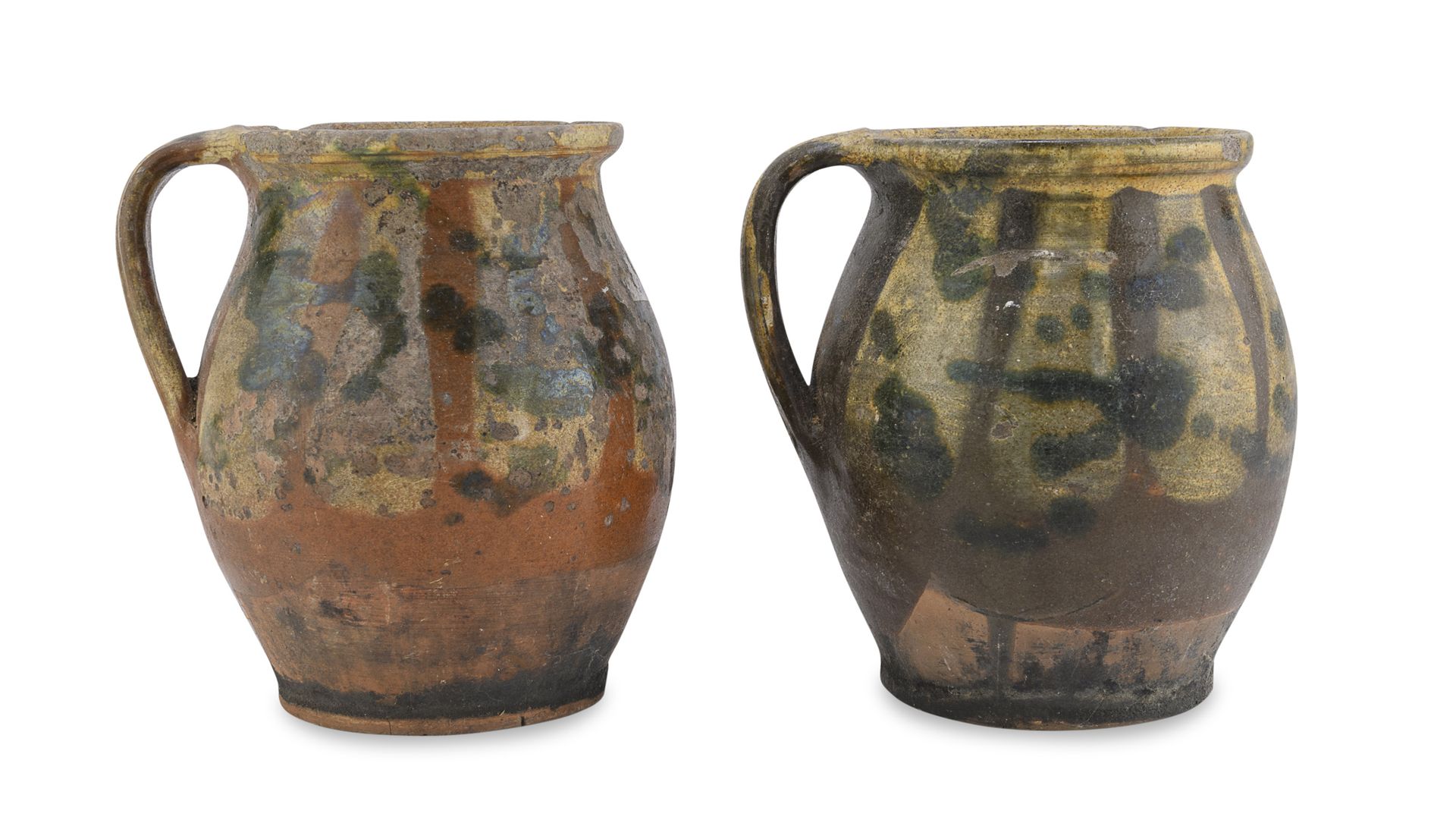 Null 两只陶罐，普格利十九世纪


在部分黄色、棕色和绿色珐琅中。


尺寸为18 x 15厘米。