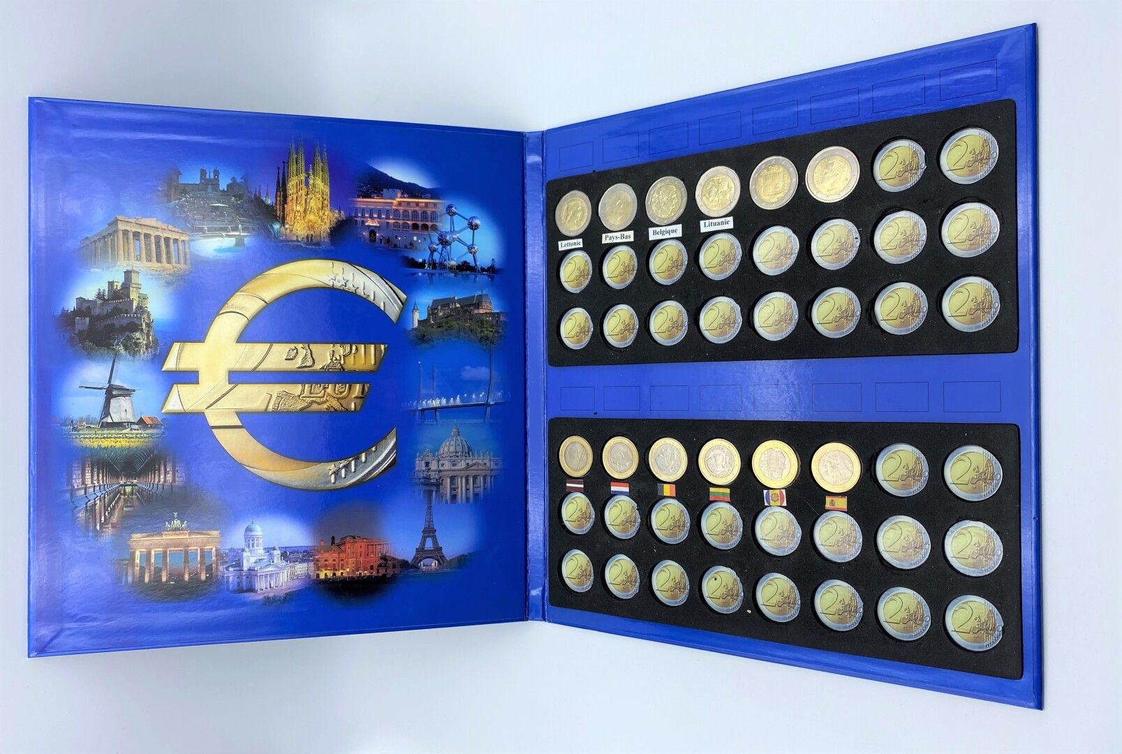 Null Numismatics - Euro,

- An album of 6 2 euro and 6 1 euro coins 

- An album&hellip;