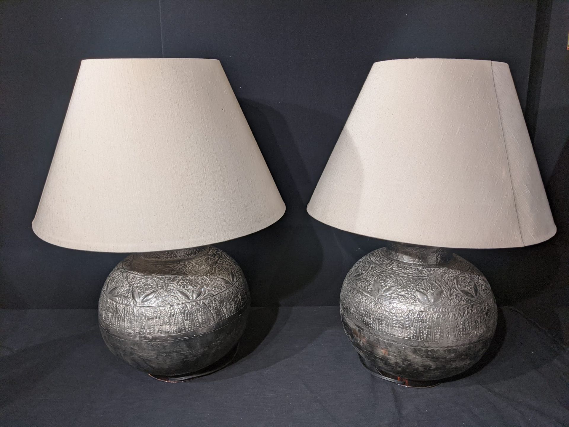 Null A pair of Eastern spherical silver colour table lamps, cream coloured shade&hellip;