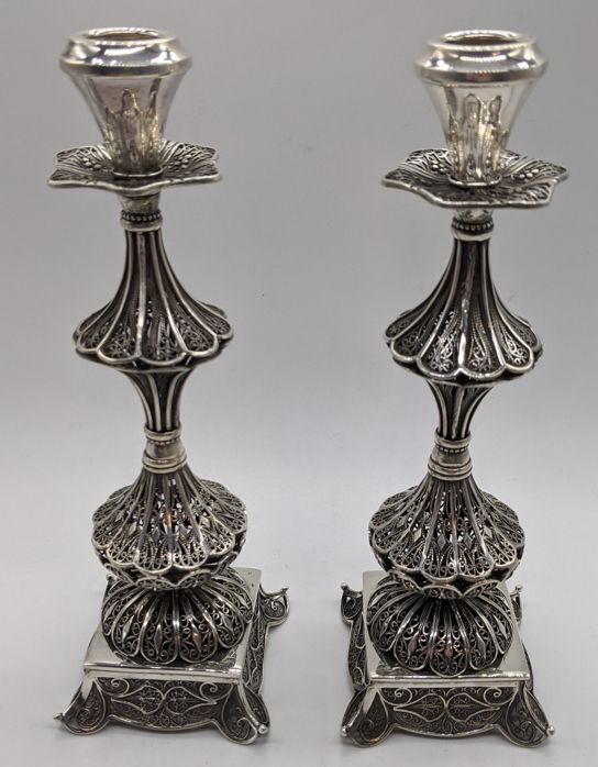 Null A pair of Middle Eastern silver filigree candlesticks, 380g, 20cm