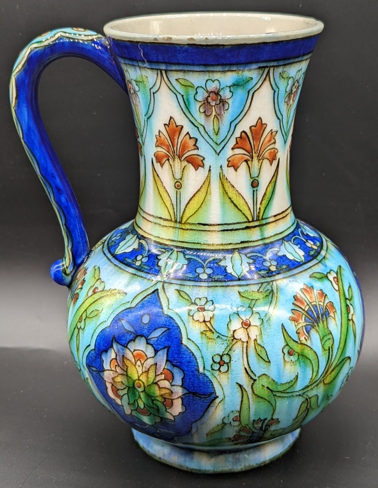 Théodore A late 19th century French Theodore deck jug in the Iznik style, H.19cm