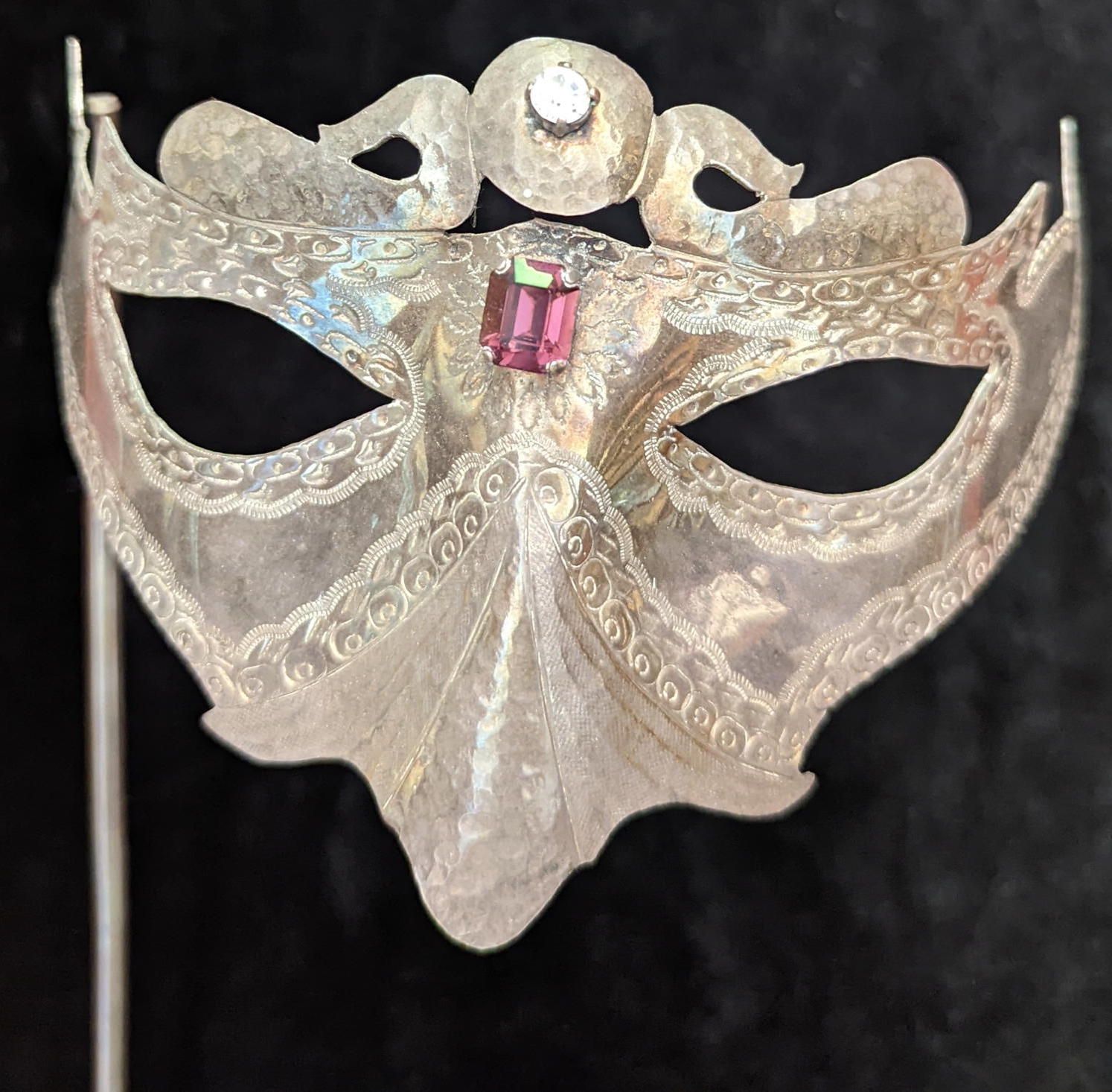 Null An Italian silver Venetian mask, mounted with 2 stones,