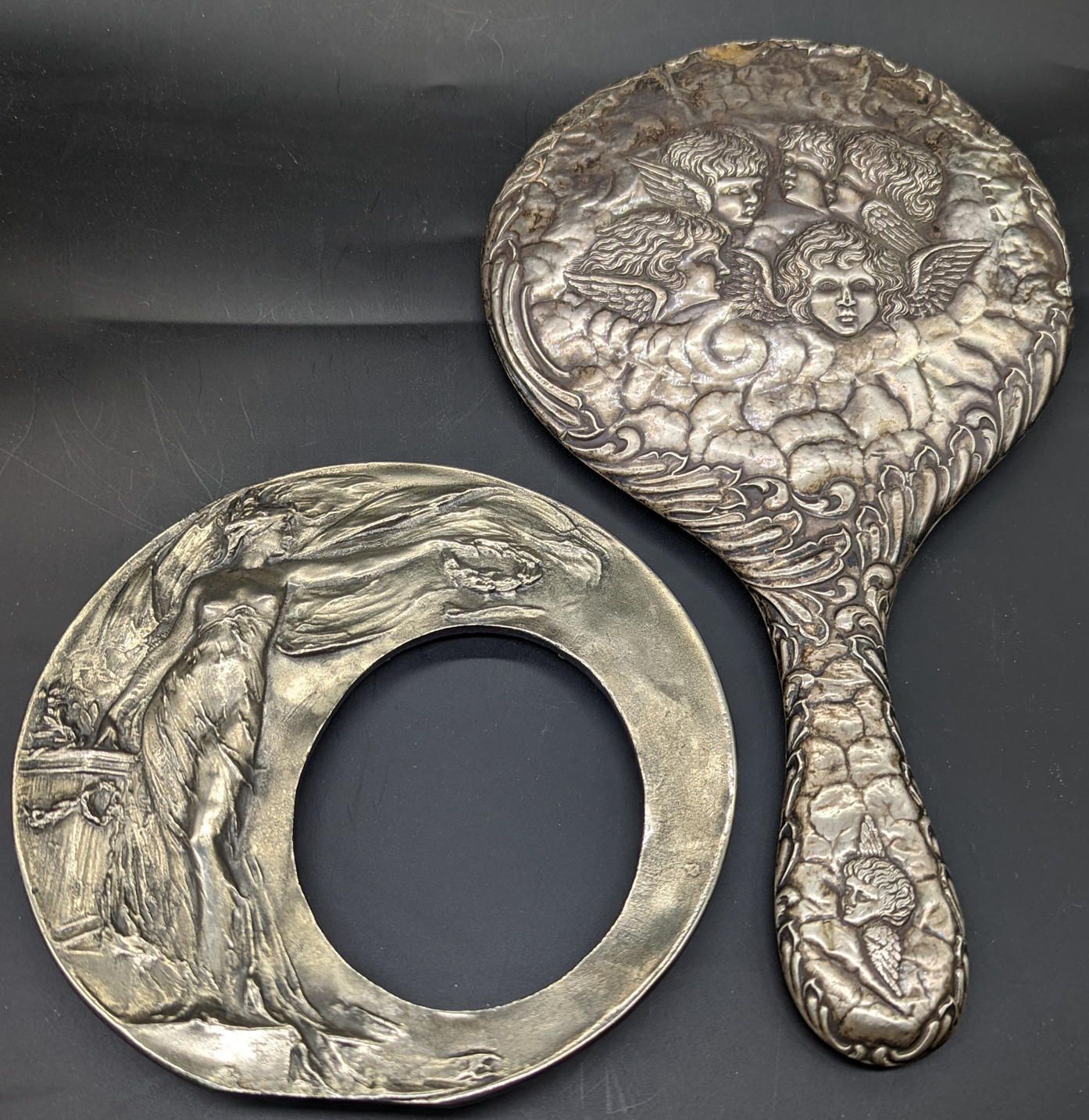 Null A silver cherub hand mirror (lacking glass), together with an Art Nouveau p&hellip;