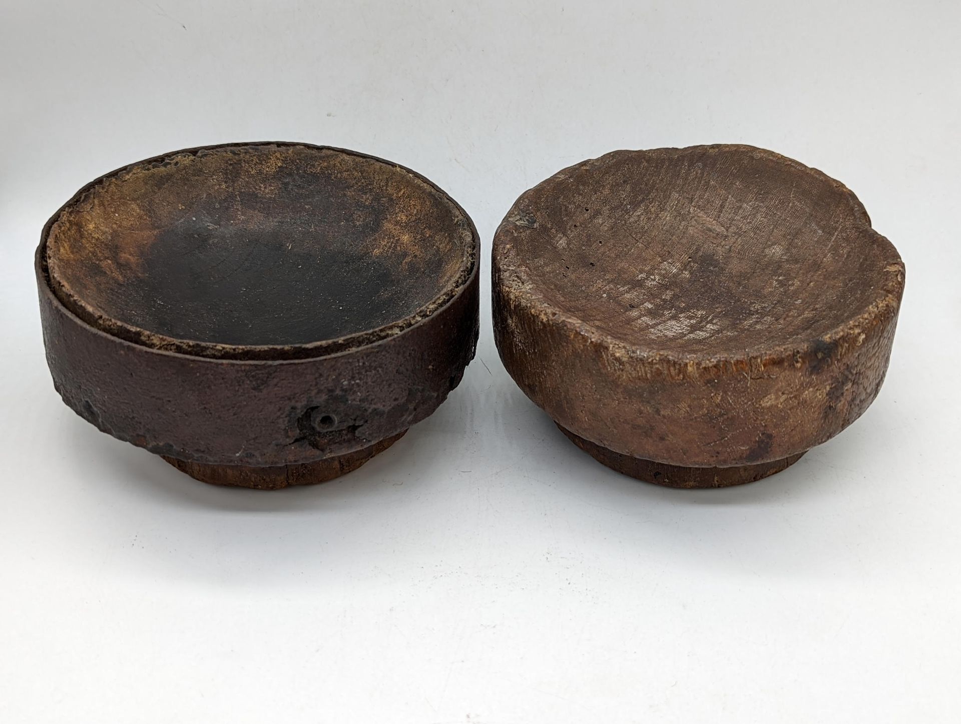 Null A pair of 18th century carved wooden mortars, D.14cm