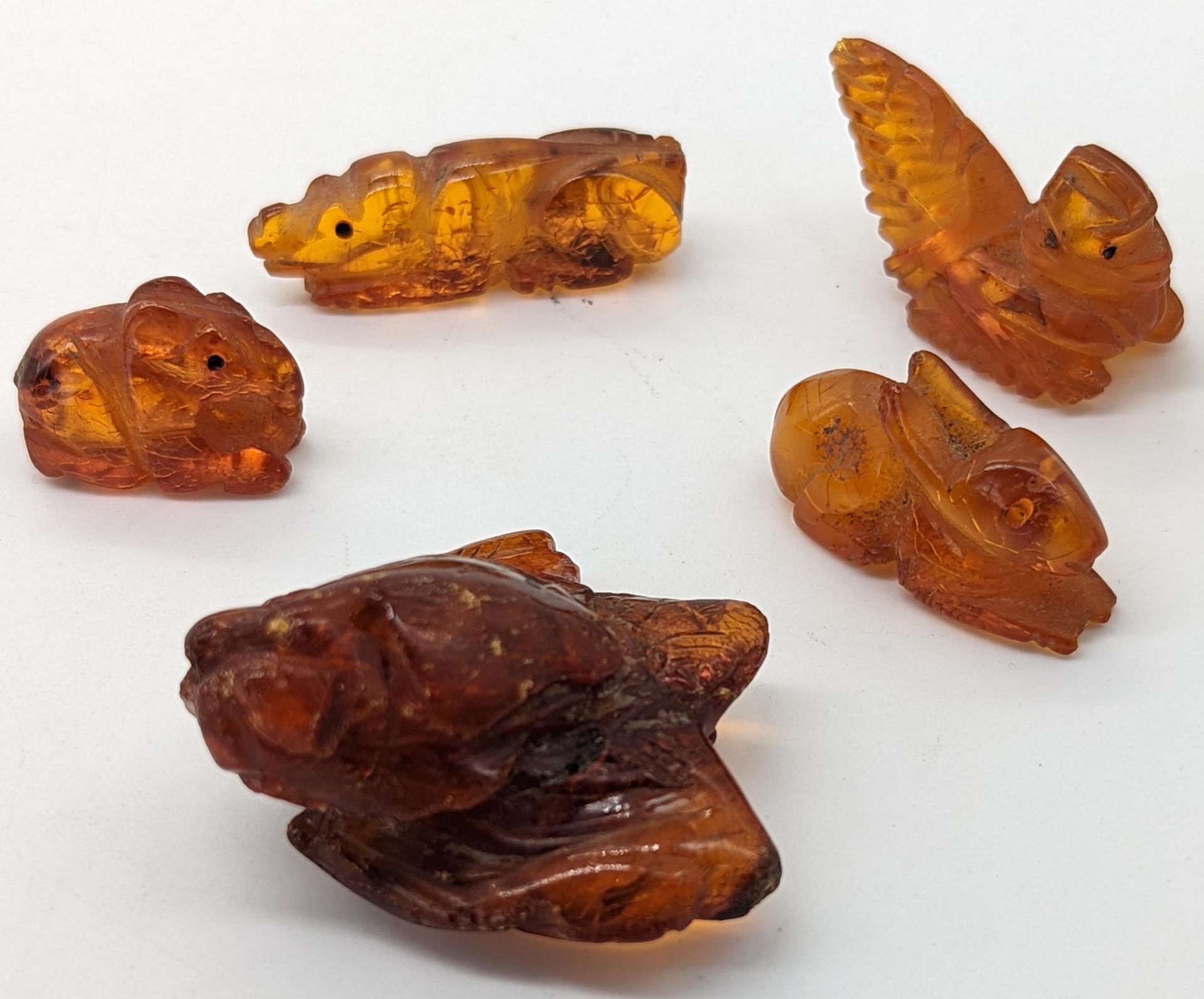 Null A collection of 5 19th century Chinese carved amber animals