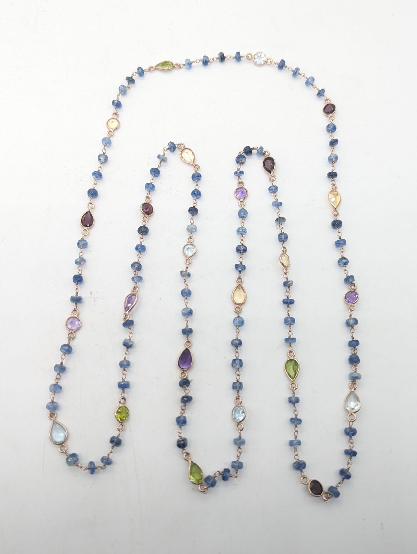 Bernhard Sickert 
An Edwardian multi-colour gemstone sapphire long chain necklac&hellip;