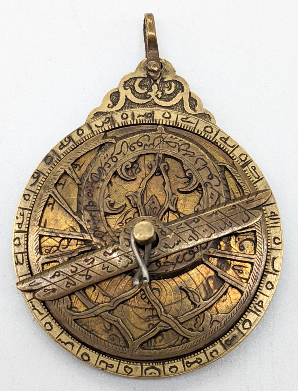 Null A rare 19th century Persian Qajar miniature brass astrolabe, D.7cm