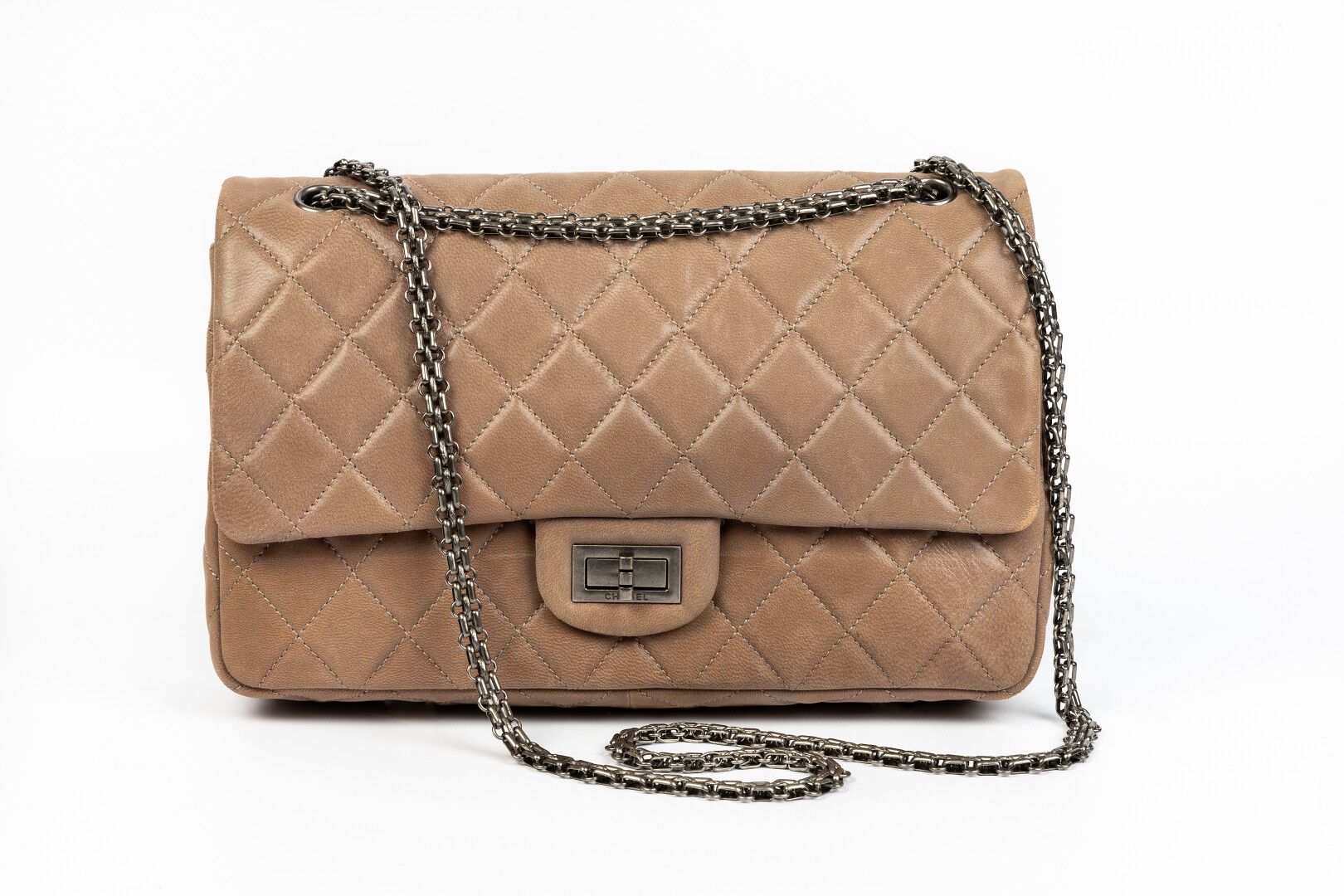CHANEL. Large 2.55 bag in quilted taupe aged calf leath…