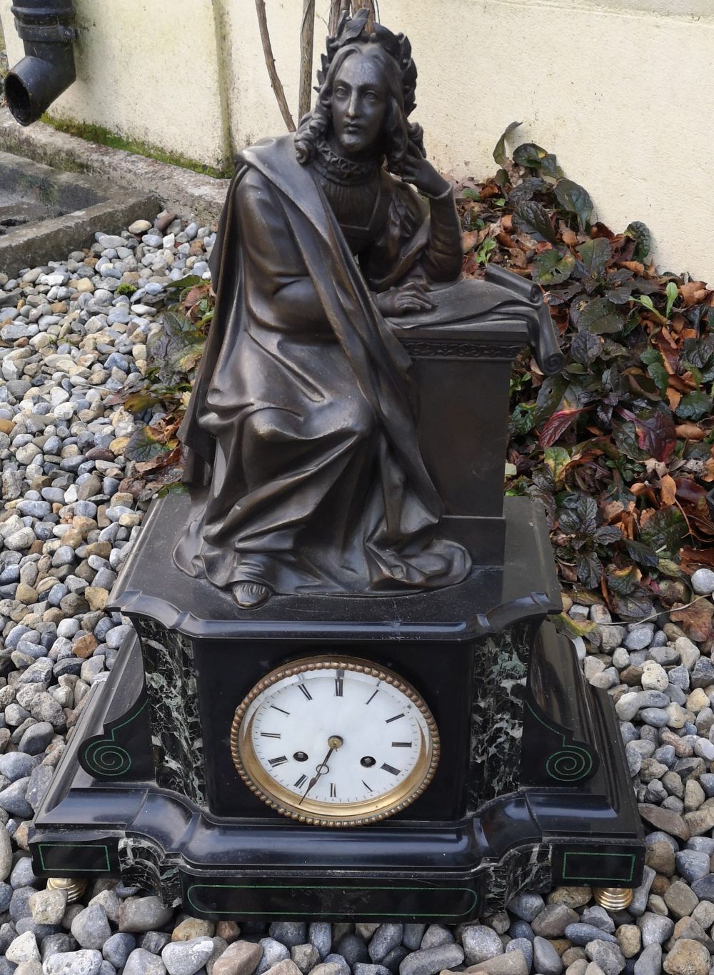 A 19TH CENTURY SLATE MANTLE CLOCK, surmounted by solid bronze figure of a philos&hellip;