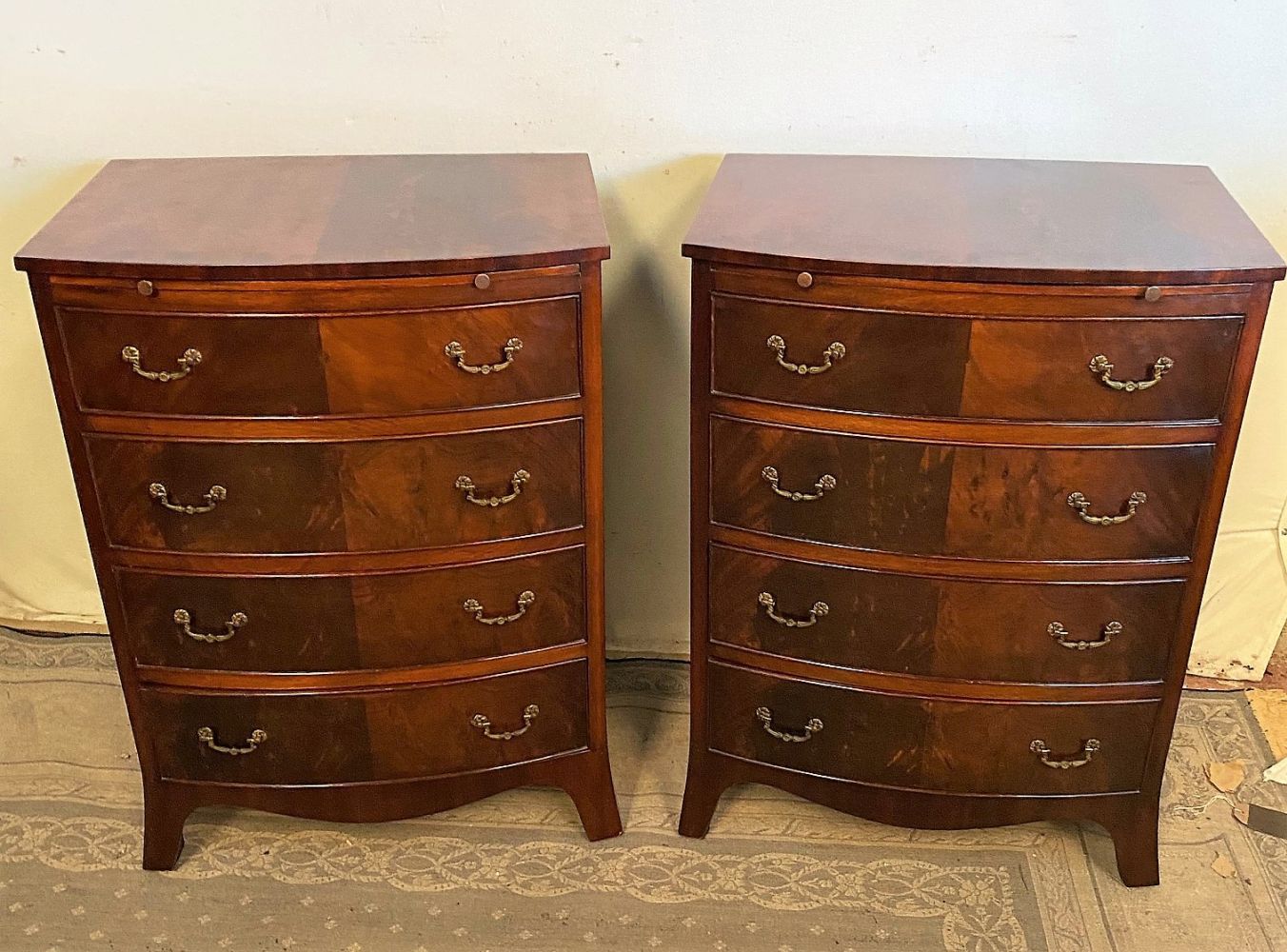 A PAIR OF BOW FRONTED MAHOGANY FOUR DRAWER CHESTS, each with a brush-slide to th&hellip;