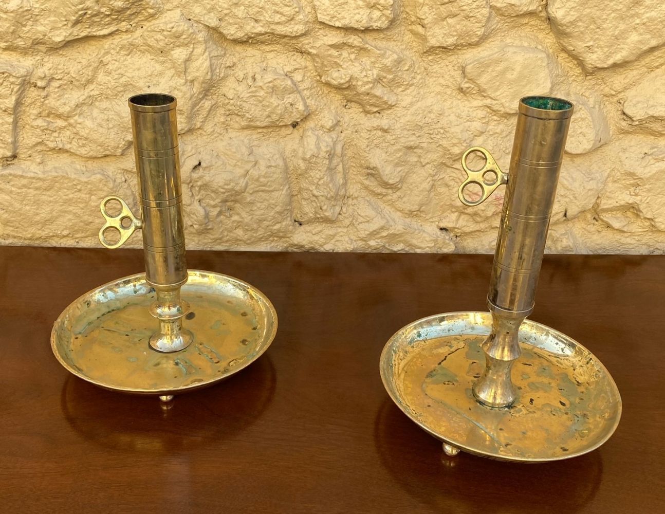 A PAIR OF RING TURNED BRASS CHAMBER CANDLE STICKS, with circular bases, 14 inche&hellip;