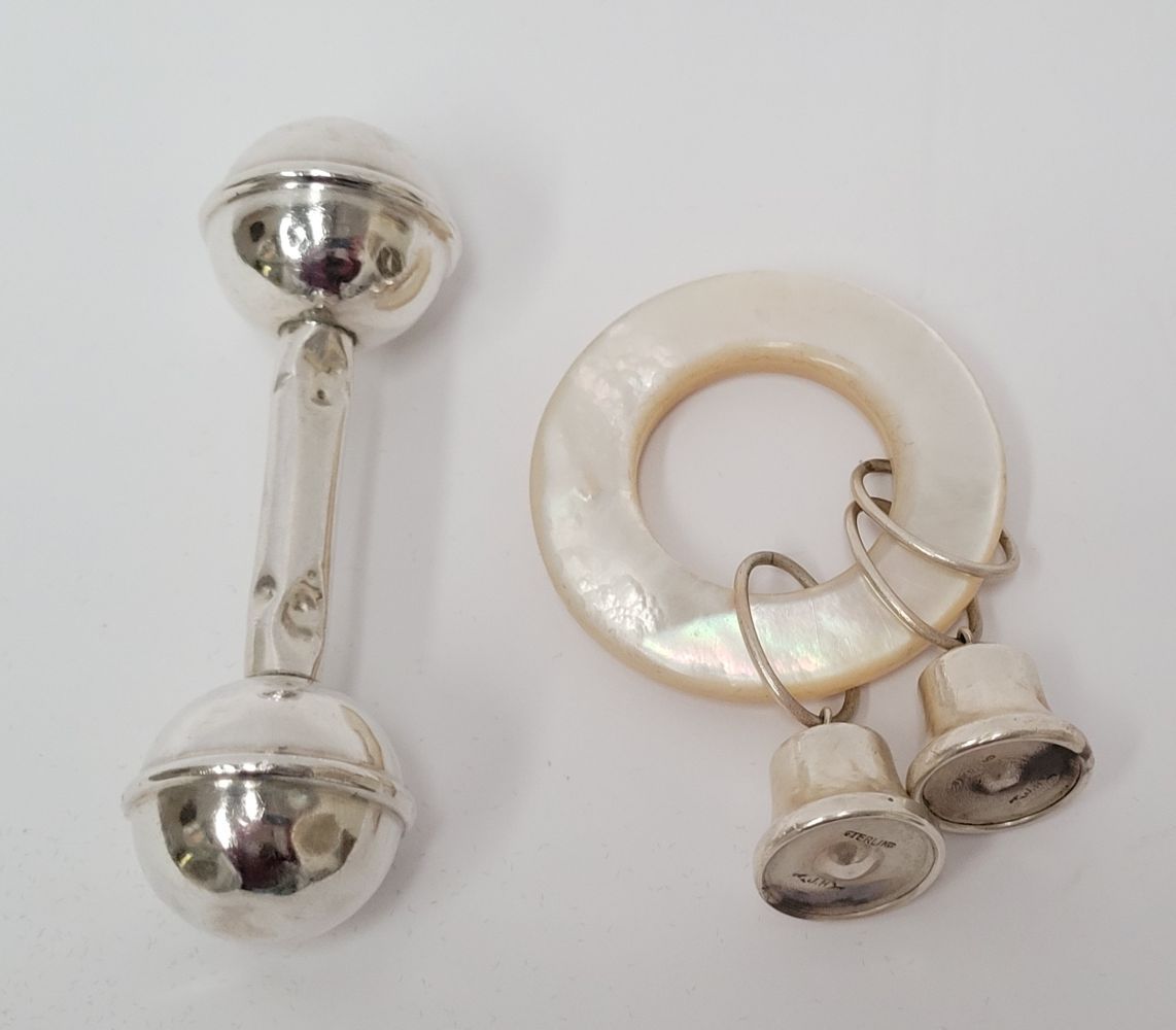 TWO CHILDS RATTLES (i) An early 20th century sterling silver child’s rattle, wit&hellip;