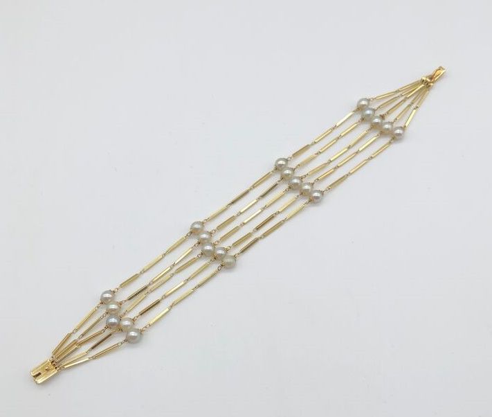 Null Bracelet cinq rangs, en or jaune 750, maille bâtons scandés de perles,

lon&hellip;