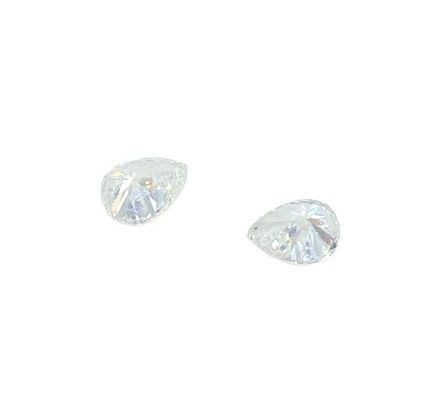 Null Two pear cut diamonds on paper, total approx. 0.25 ct
