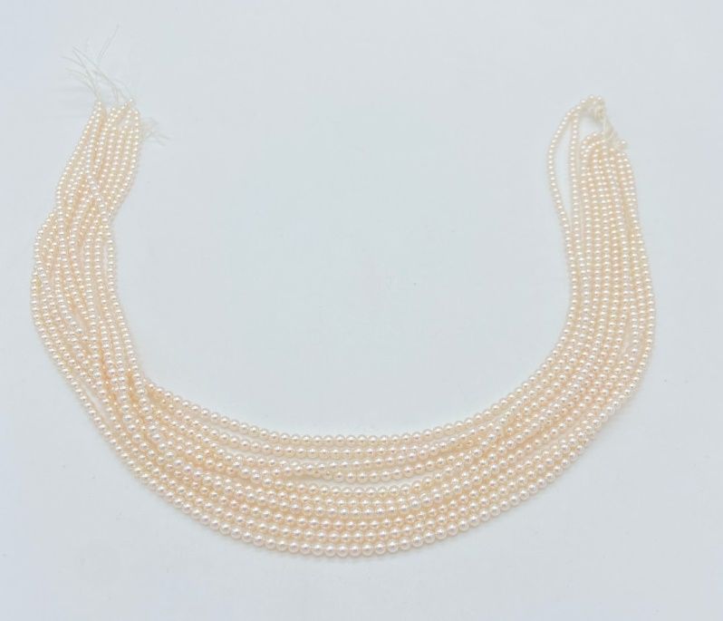 Null 10股带线的Akoya种子珠，无扣子（直径约2.5 - 3毫米）。