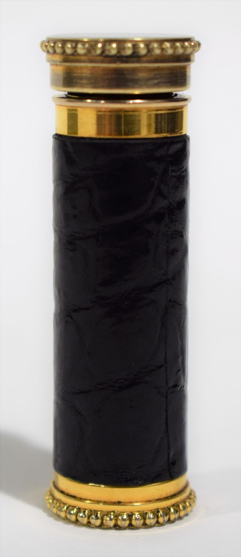 Null 气泵 "Le KID.法国"，镀金金属和黑色皮套，用于清洁相机或唱片，展开长度9厘米，带皮套