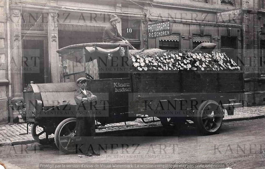 Null (AUTOMOBILE) Postcard of a lumber truck in front of P.C. Schoren's photogra&hellip;