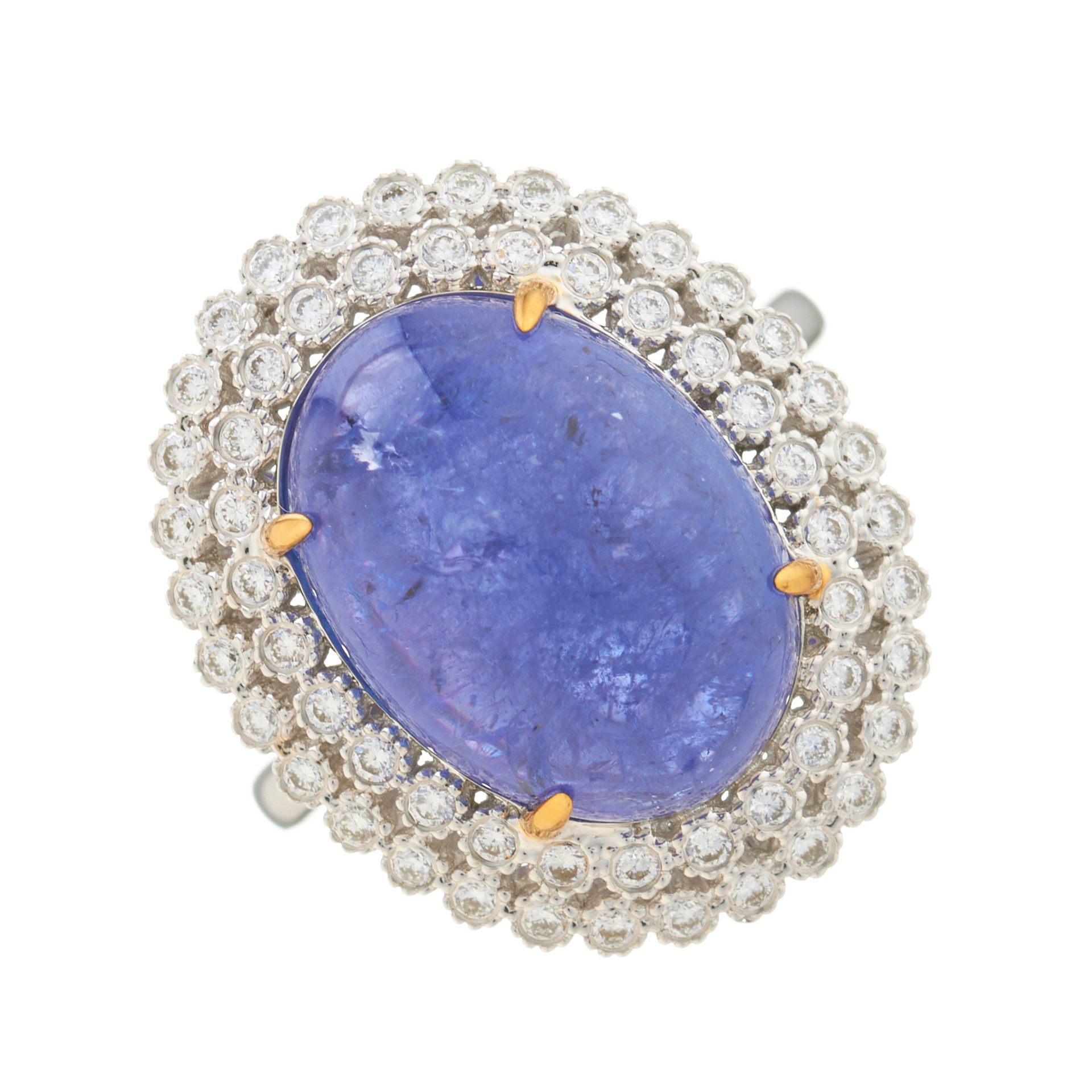 Null An 18ct gold tanzanite cabochon and brilliant-cut diamond cluster ring, tan&hellip;