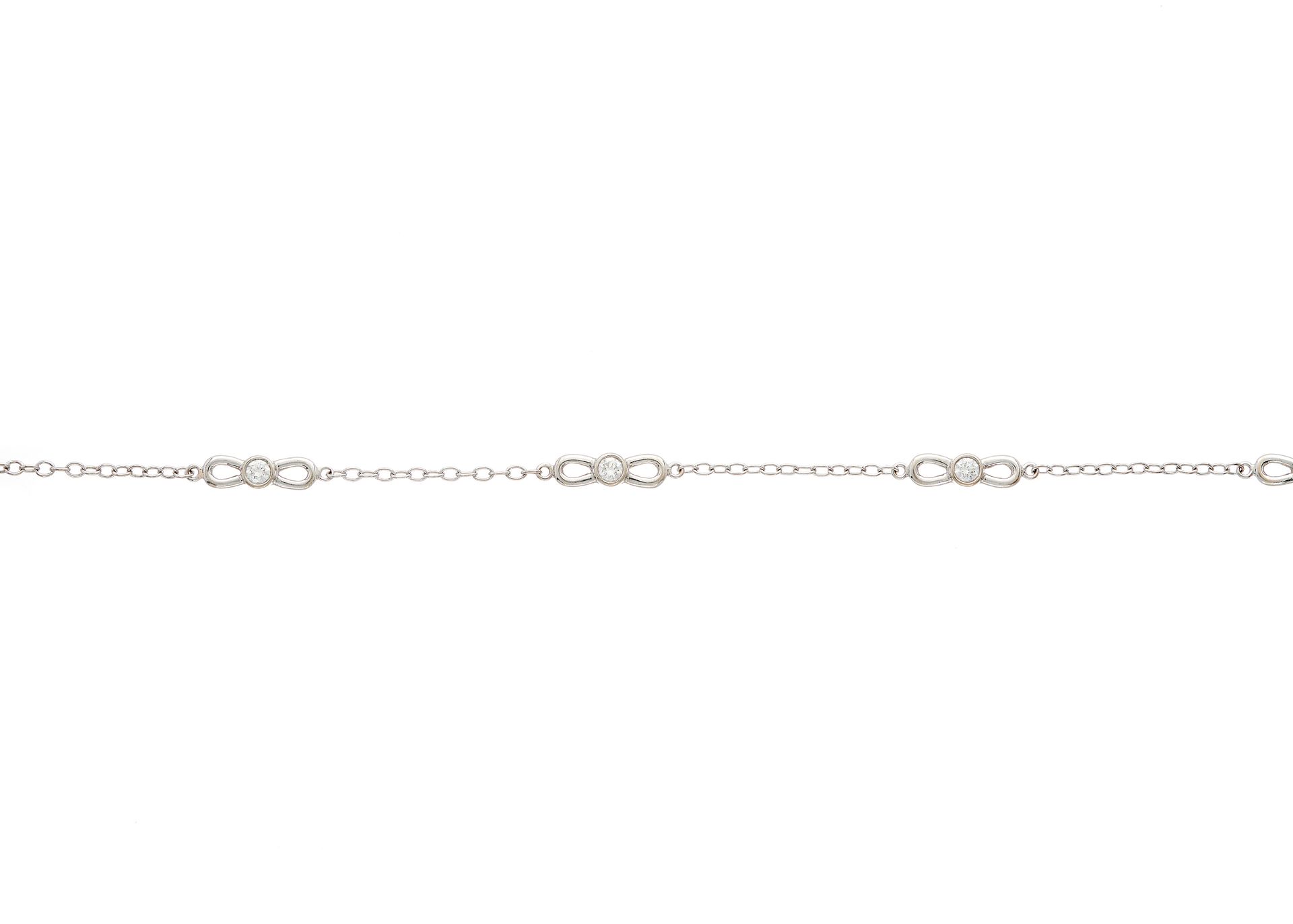 Null Tiffany & Co., 一条18K金明亮式切割钻石蝴蝶结手链，带龙虾扣，签名为Tiffany & Co.，估计钻石总重0.35克拉，G-H色，V&hellip;