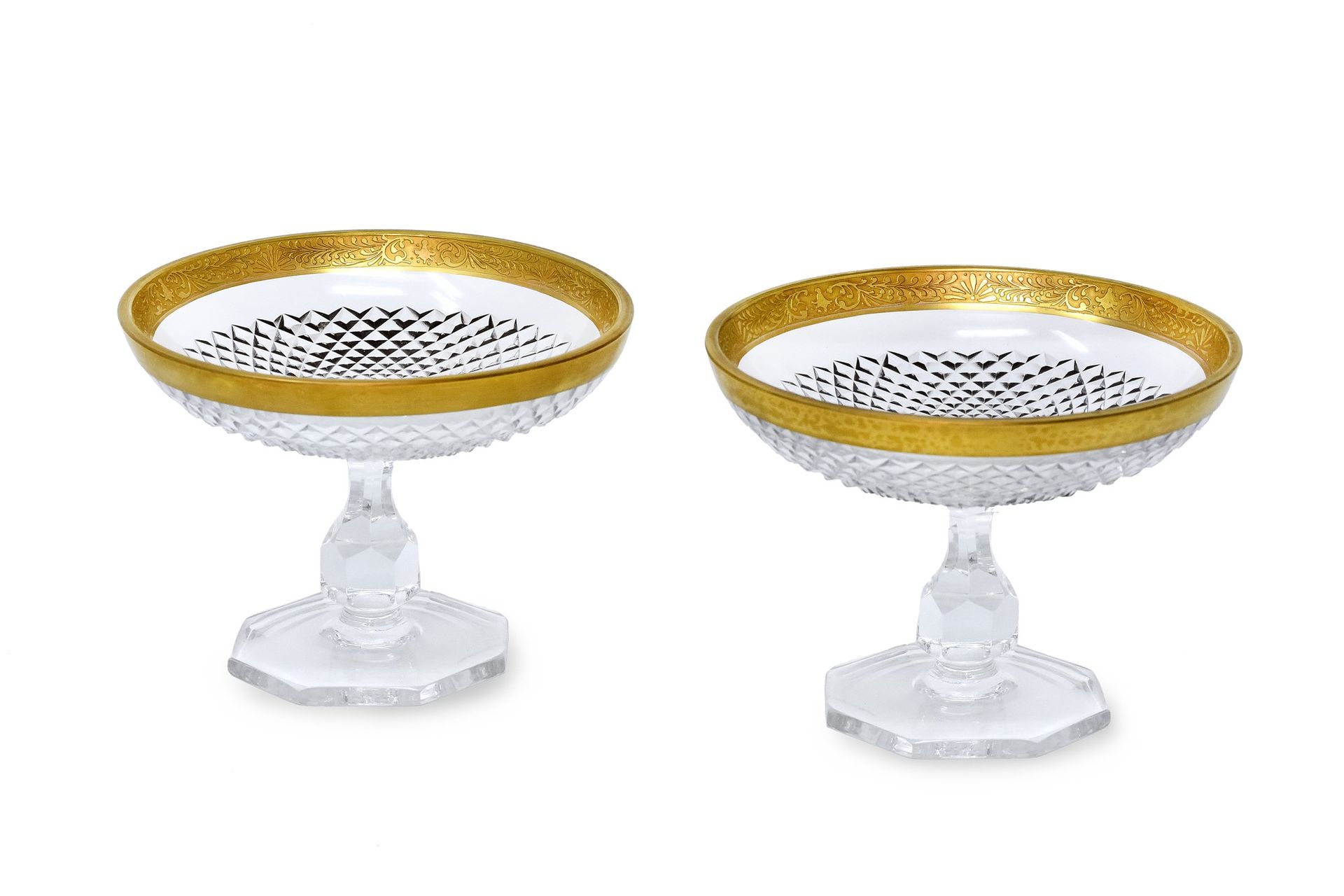 Null Lot consisting of two Baccarat crystal worked risers with golden profile.

&hellip;