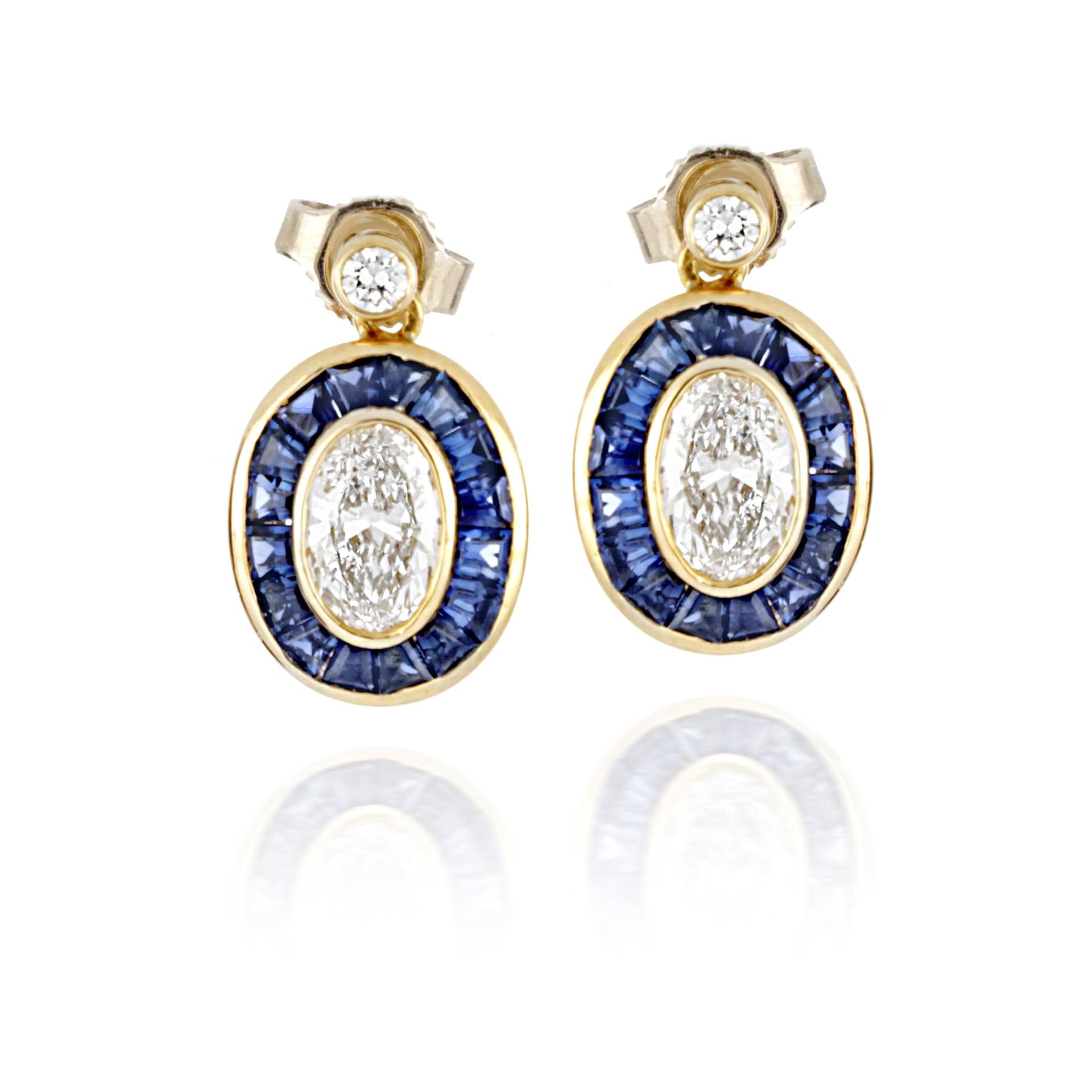 Null Earrings in 18-karat yellow gold, with carat sapphires totaling about 2.56 &hellip;