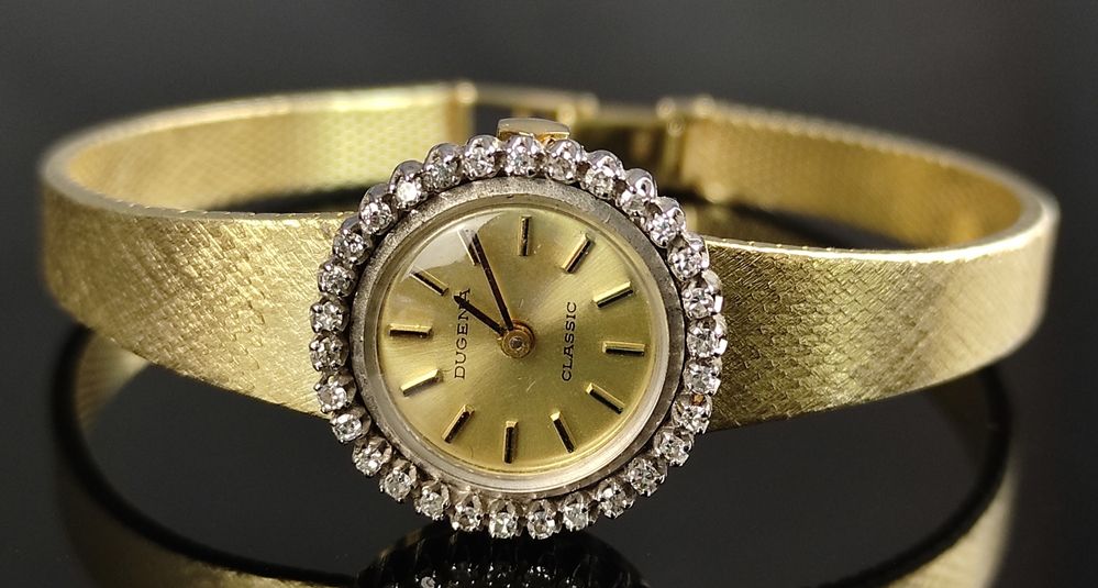 Null 女士腕表，Dugena Classic，腕表印有585/14K黄金，圆形表圈镶嵌30颗小钻石，直径20毫米，重27.3克，长17.8厘米
