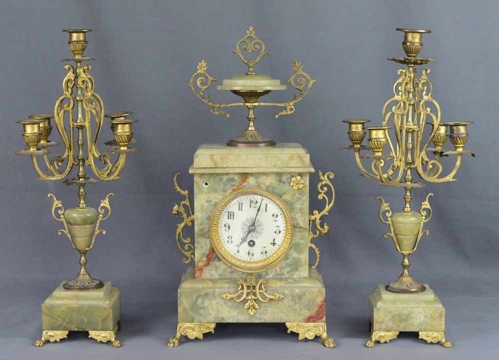 Null Fireplace triptych, consisting of two five-flame candlesticks and a clock, &hellip;